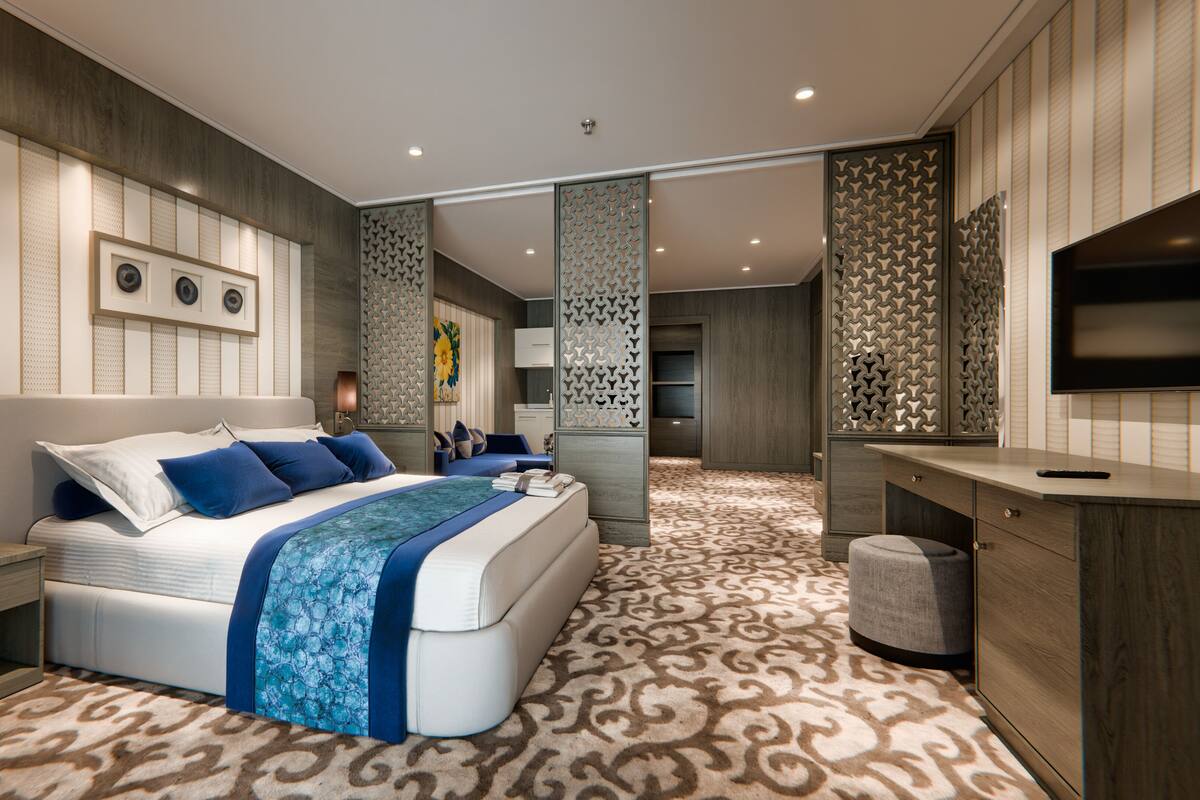 Une chambre moderne avec un grand lit, des tables de chevet, un bureau et un téléviseur.