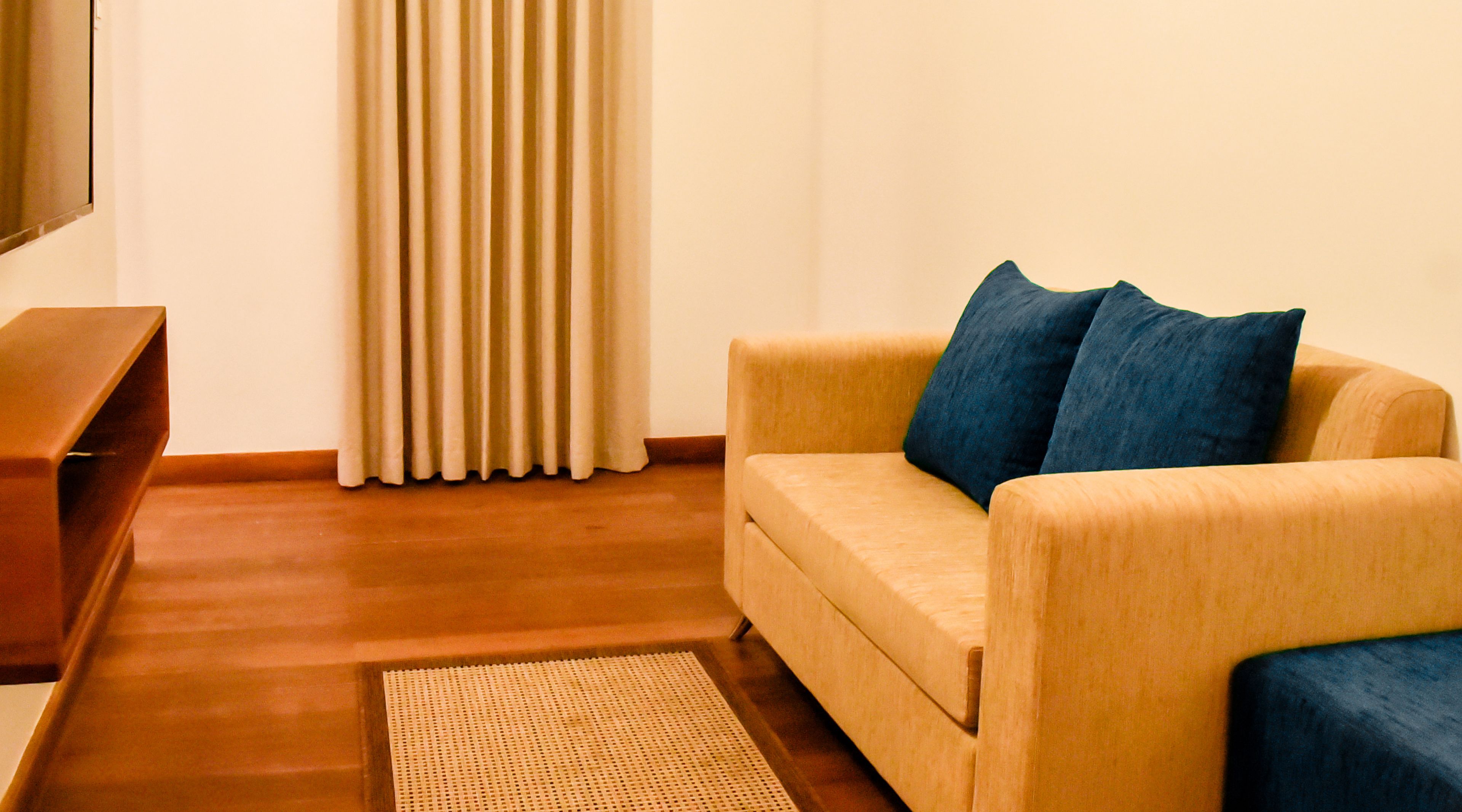 superior king suite with garden view | living room | flat-screen tv