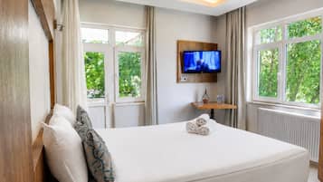 Economy Room, Balcony, Partial Lake View | Living area | LCD TV, table tennis