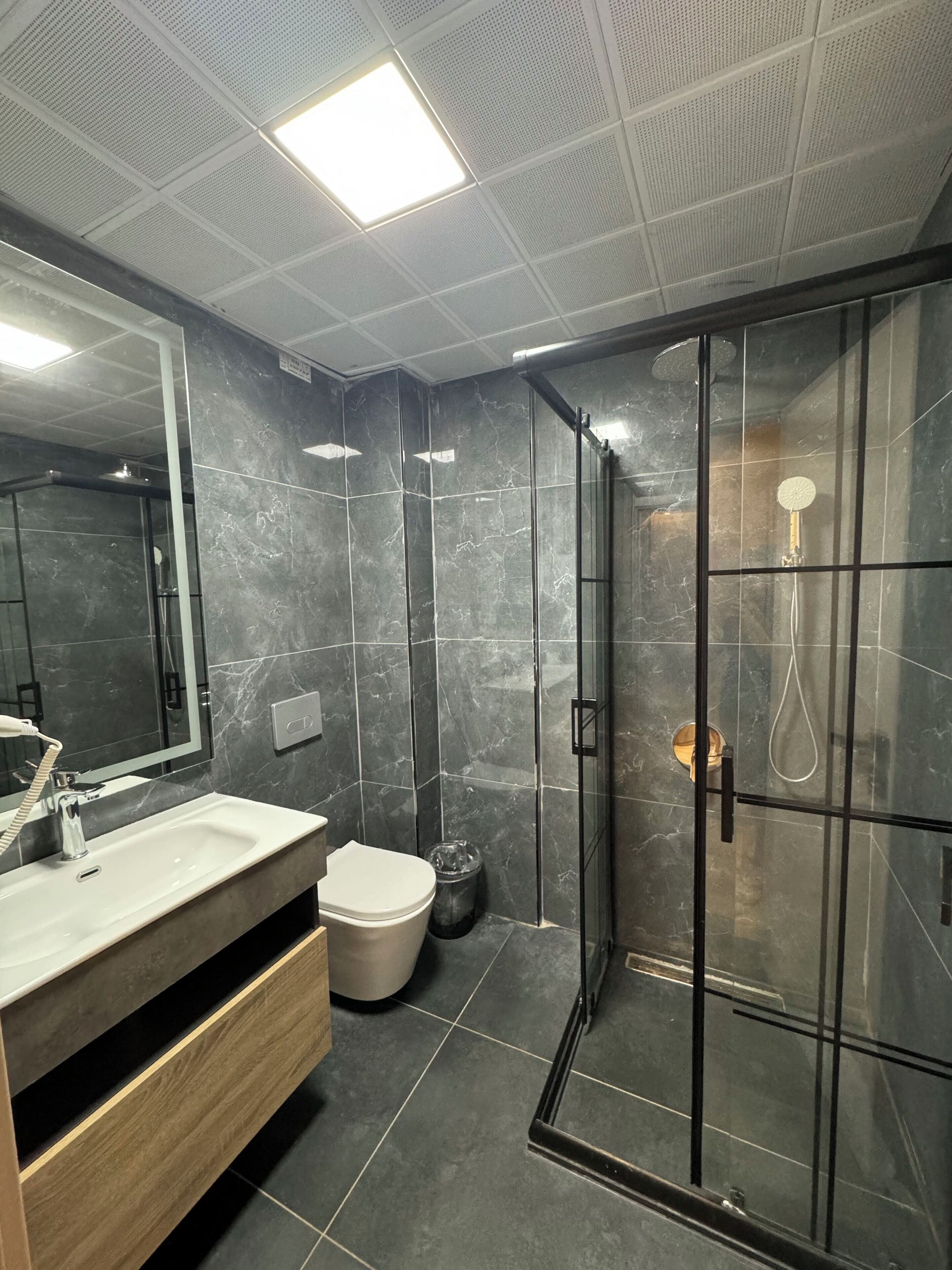 Shower, free toiletries, hair dryer, slippers