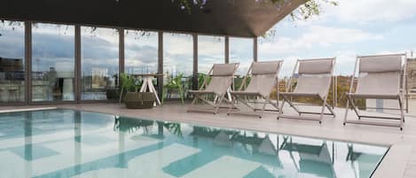 Seasonal outdoor pool, open noon to 8:00 PM, sun loungers