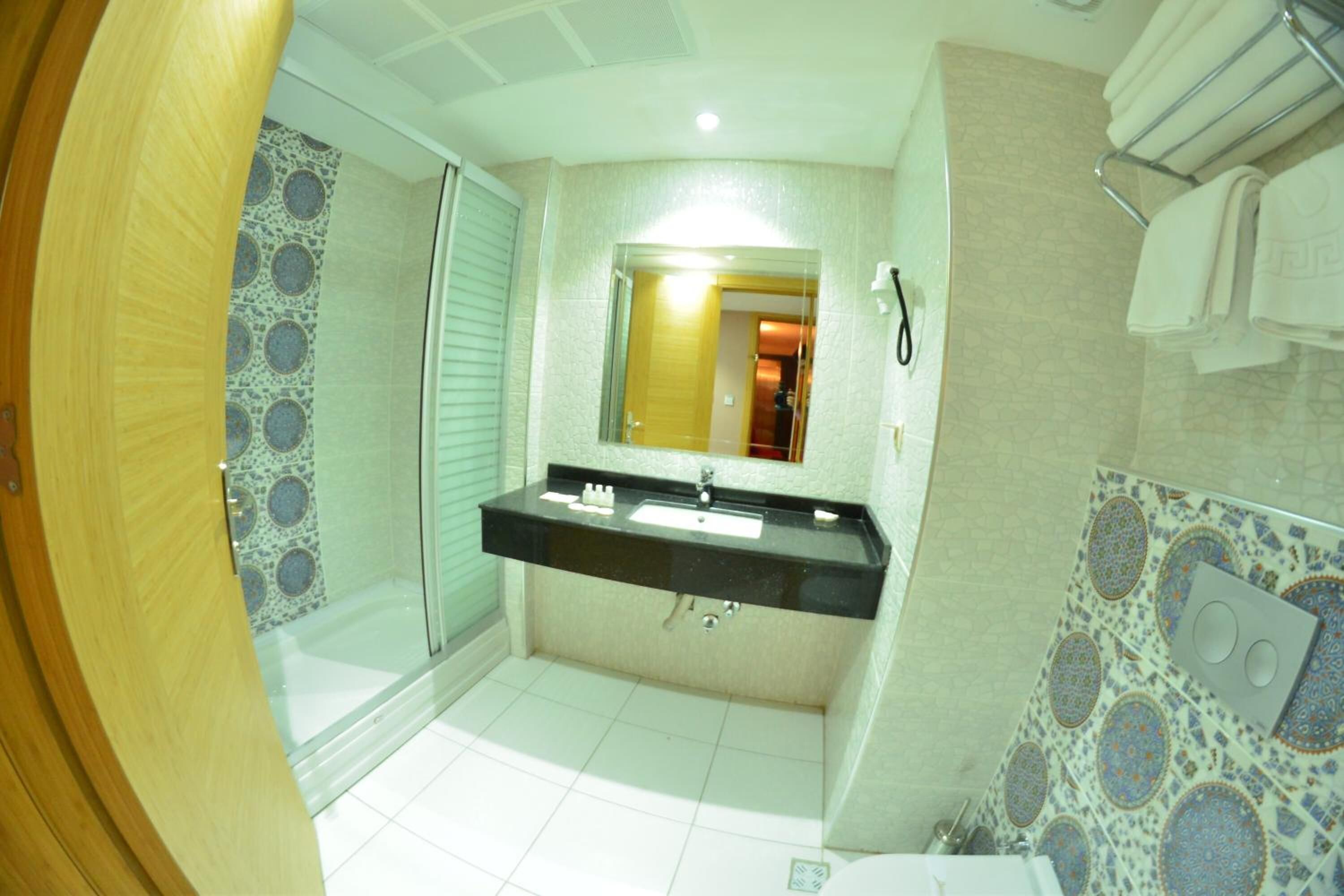 Shower, free toiletries, hair dryer, slippers