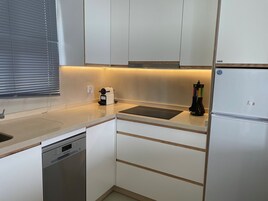 Design Apartment, 1 Bedroom, Sea View | Private kitchen | Full-size fridge, microwave, oven, stovetop
