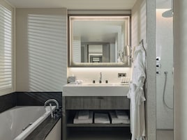 Standard Room, 1 King Bed, City View | Bathroom | Separate tub and shower, free toiletries, hair dryer, bathrobes