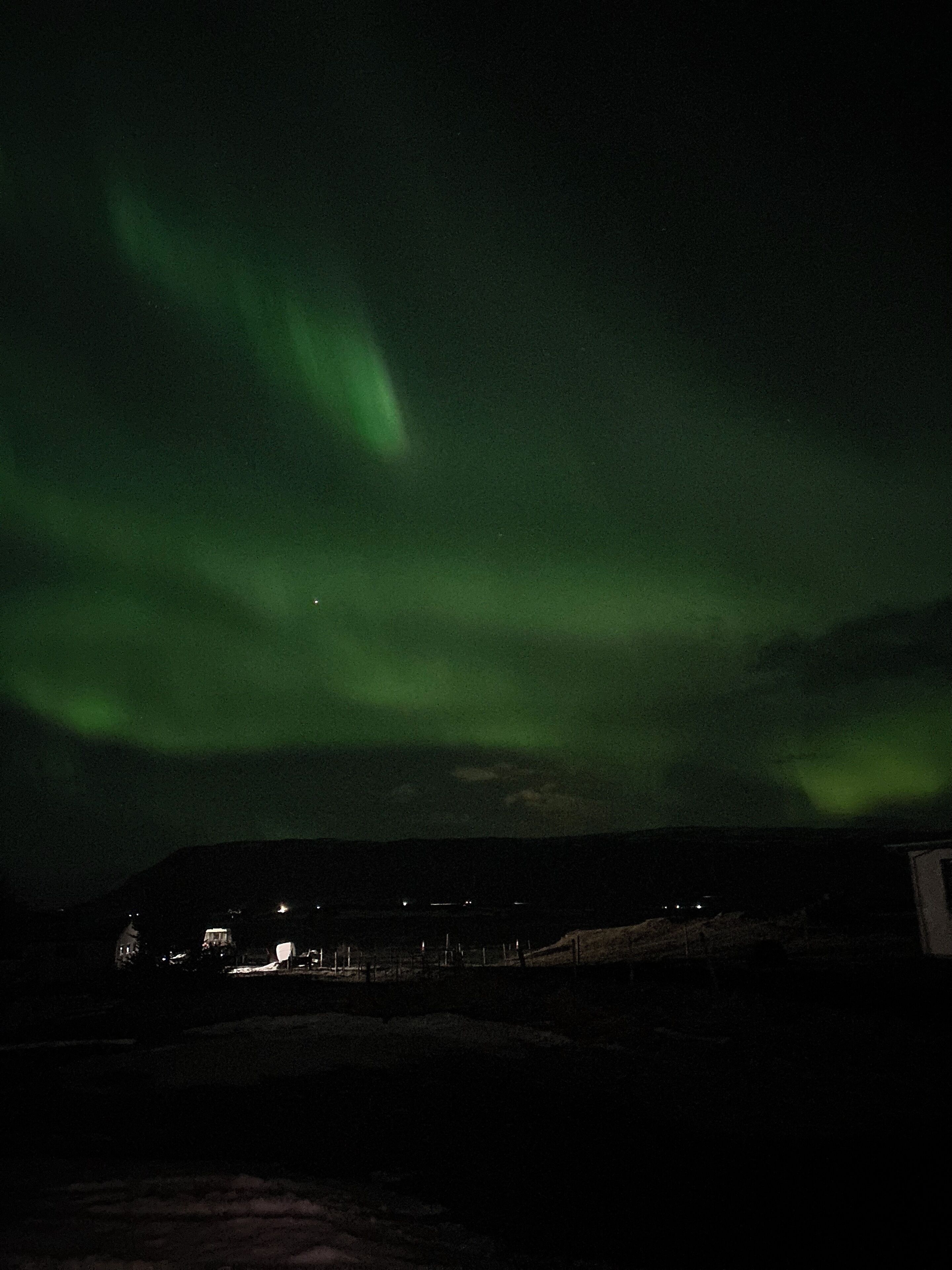 A night sky with the aurora borealis.
