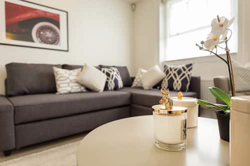 Apartment - Split Level | Living area | Flat-screen TV