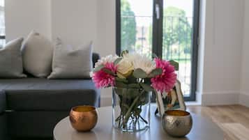 Deluxe Two Bedroom Apartment with Balcony | Living area | Flat-screen TV