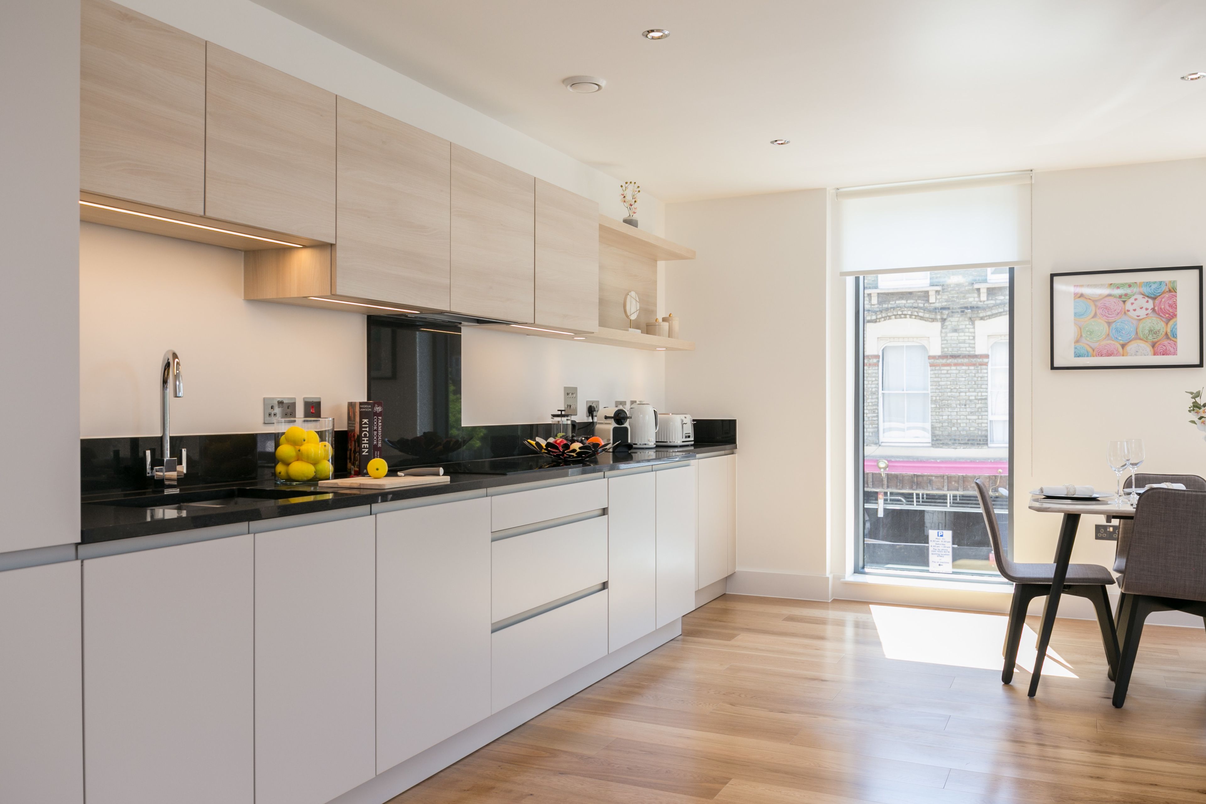 Deluxe Two Bedroom Apartment with Balcony | Private kitchen | Full-size fridge, microwave, oven, stovetop