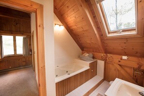 Bathtub, jetted bath, hair dryer, towels