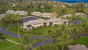 A resort with multiple buildings, lush greenery, and a view of the ocean. - Amazing View ~ Amazing Price ~ Amazing Location  (Princeville)