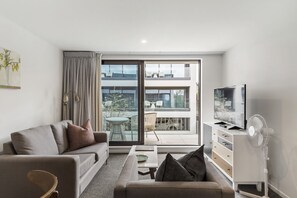 Superior Suite, 2 Bedrooms | Living area | 50-inch Smart TV with digital channels