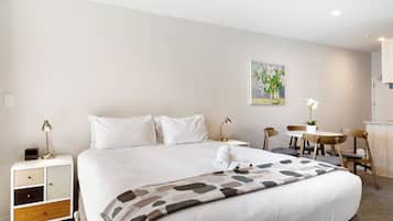 Premium bedding, blackout curtains, soundproofing, iron/ironing board