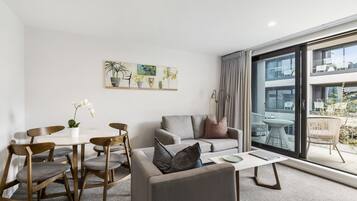 Superior Suite, 2 Bedrooms | Living area | 50-inch Smart TV with digital channels