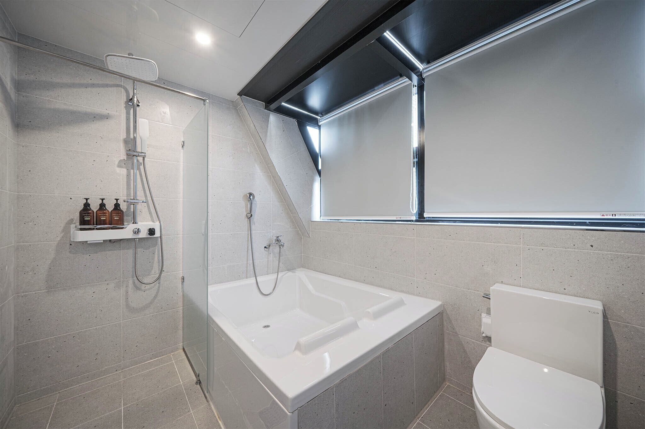 vip ocean view room | bathroom | combined shower/bathtub, rainfall showerhead, designer toiletries
