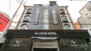 A Lucas Hotel building with a modern facade, multiple balconies, and a prominent entrance. - Lucas Hotel (Changwon)
