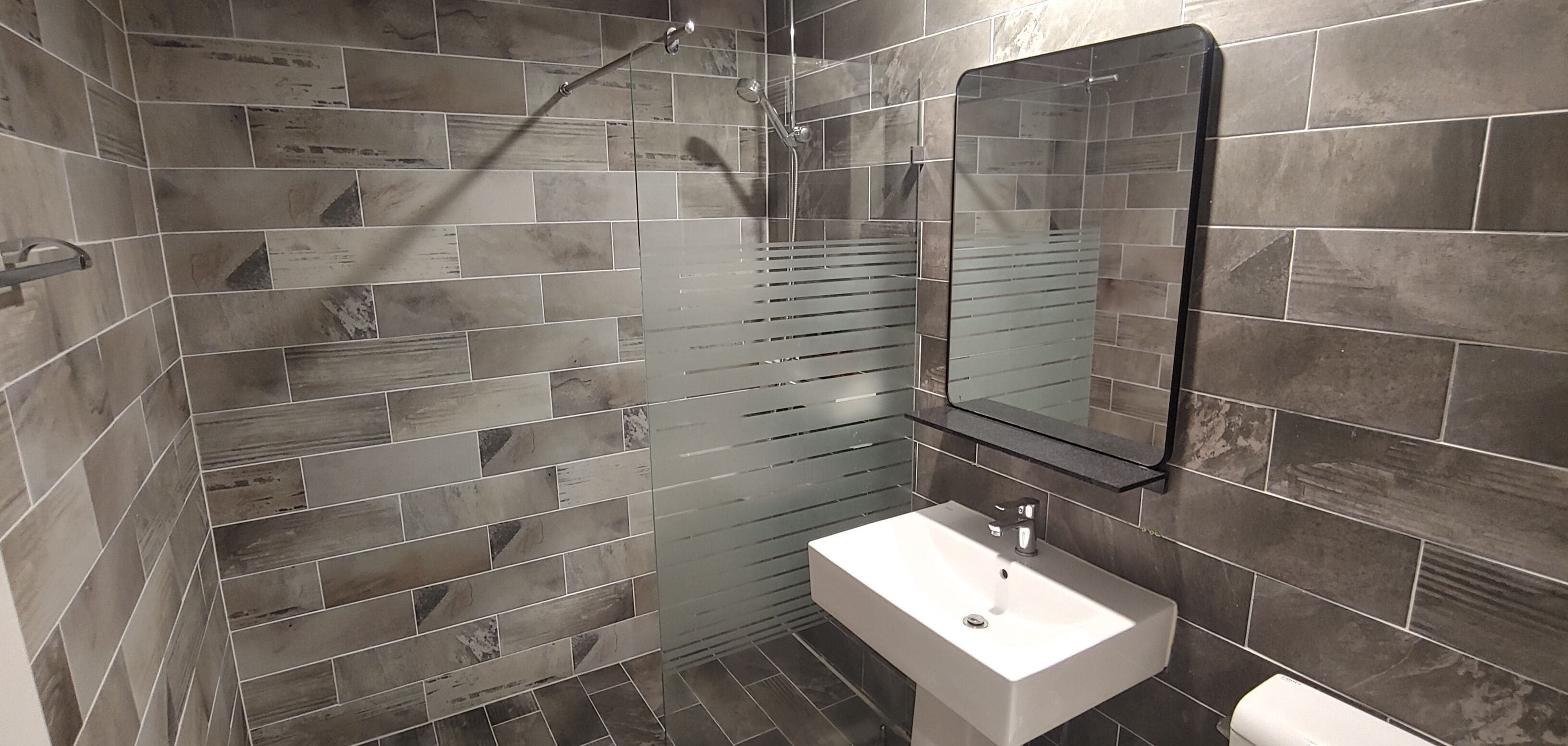 combined shower/bathtub, rainfall showerhead, designer toiletries