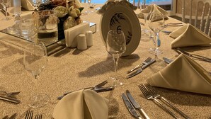 A table set for a meal with a view of a swimming pool and greenery. - Hotel Excellence Inn (Ankara)