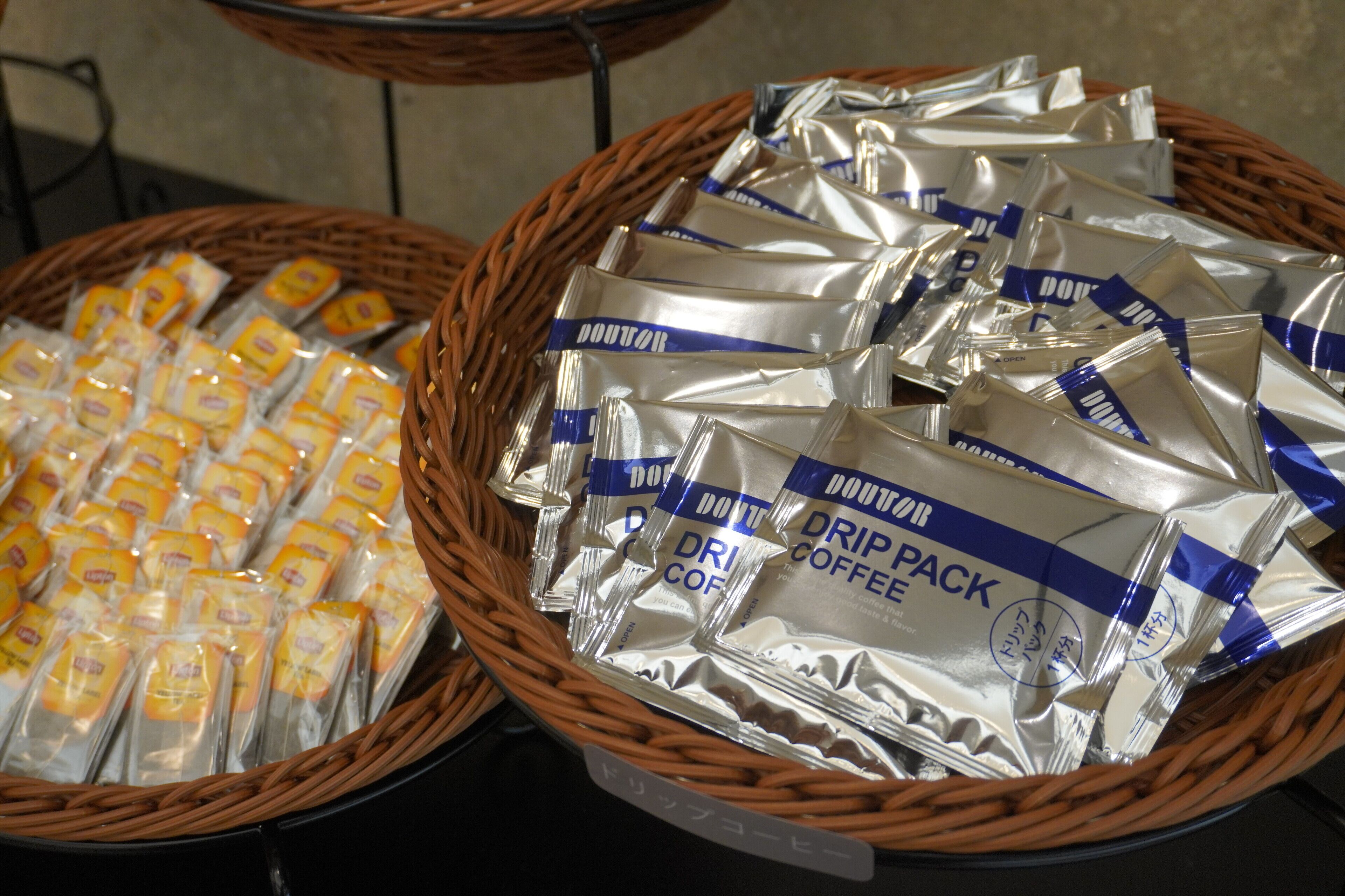 Two baskets filled with coffee packets.