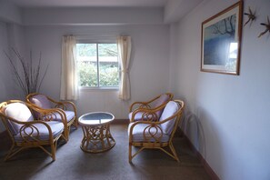 Deluxe Double Room | Living area | 24-inch TV with cable channels - A.P. Court Hotel (Mueang Loei)