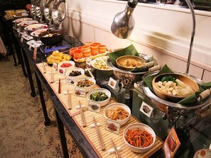 A buffet with various dishes and utensils. - Koriyama Washington Hotel (Koriyama)
