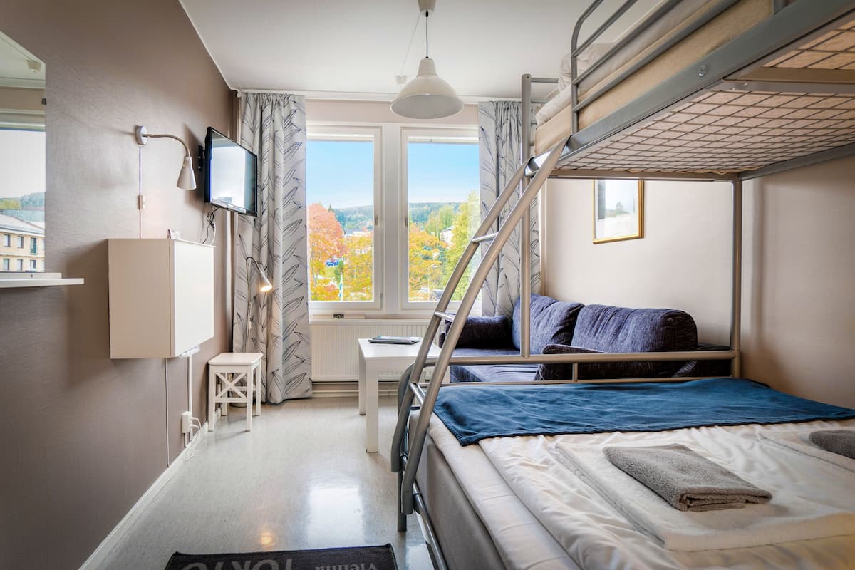 Family Room | In-room safe, desk, blackout curtains, iron/ironing board
