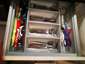 A drawer with neatly organized utensils including forks, knives, and spoons. - SHS Suite Home Sweet Strassen III (Strassen)