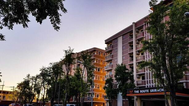 A multi-story hotel with a sign reading "The Route Shirach." - The Route Sriracha Hotel And Residence (Si Racha)