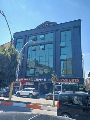 A modern building with large windows and a flat roof.