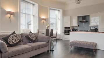 "Platinum" Luxury Apartment Double Bed with Double Walk-in Shower | Living area | 55-inch flat-screen TV with satellite channels, Smart TV, Netflix