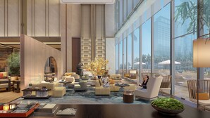 A spacious lobby with high ceilings, large windows, and a variety of seating arrangements. - InterContinental Quanzhou by IHG (Quanzhou)
