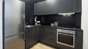 Family Apartment, 2 Bedrooms, Accessible, Kitchen | Private kitchen | Espresso maker, coffee/tea maker, full-size fridge, stovetop - Suitcase (Thessaloniki)