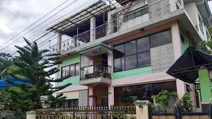 A multi-story residential building with balconies and large windows. - A's Azotea de Bohol (Tagbilaran)