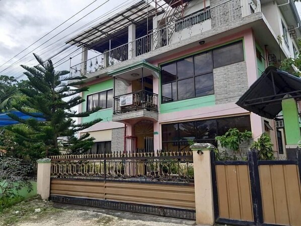 A multi-story residential building with balconies and large windows. - A's Azotea de Bohol (Tagbilaran)