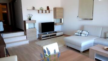 Deluxe Apartment, 2 Bedrooms, Terrace, Sea View | Living area | Flat-screen TV