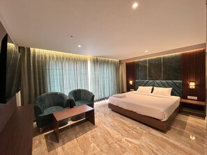 Chambre Deluxe, 1 trÚs grand lit | 1 chambre, draps en coton égyptien, literie de qualité, minibar