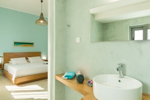 Vila família, 2 quartos | Banheiro | Chuveiro, produtos de toalete grátis, secador de cabelo 