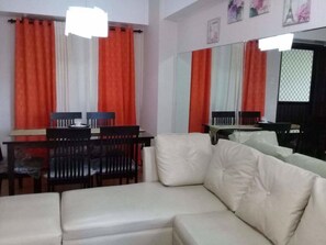 Flat-screen TV - Your Home Away From Home Royal Palm (Taguig)