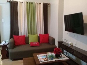 Flat-screen TV - Your Home Away From Home Royal Palm (Taguig)