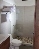 Shower, designer toiletries, towels