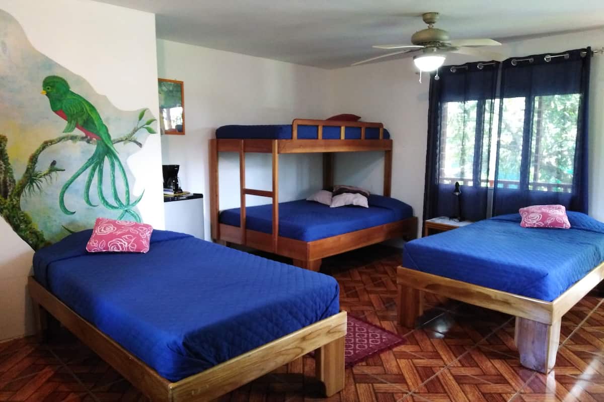 family room, multiple beds, garden view | in-room safe, free wifi, bed sheets