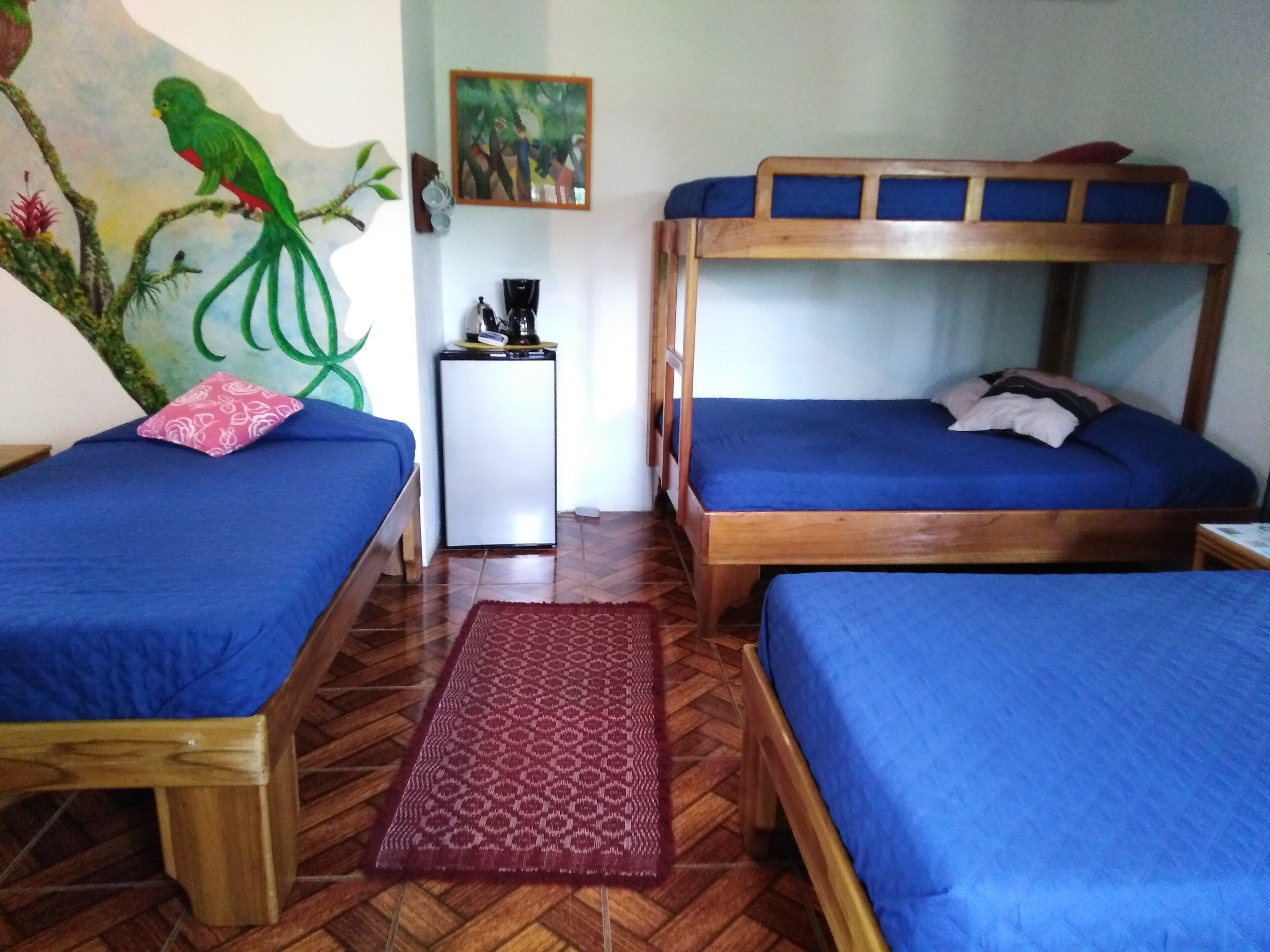 family room, multiple beds, garden view | in-room safe, free wifi, bed sheets