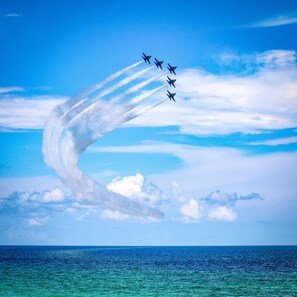 A group of jets flying in formation over a body of water. - Amazing Beach & Sunset Views, Free Lazy Days Beach Chairs/Umbrella provided (Pensacola Beach)