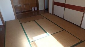 A room with tatami mats, a wooden floor, and a sliding door. - Marine Plaza Y's Dream (Oshima)