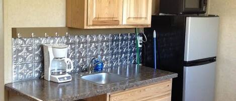 Fridge, microwave, coffee/tea maker, toaster