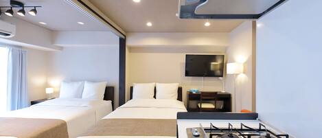 ビジネス ダブルルーム | ノートパソコン用作業スペース、遮光カーテン、WiFi (無料)、ベッドシーツ