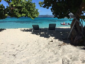 On the beach, sun loungers, beach towels