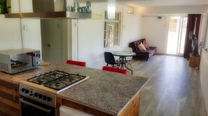 Comfort Apartment, 1 King Bed, Garden View, Garden Area | Private kitchen | Full-size fridge, microwave, coffee/tea maker - Seven Elements (La Gaulette)