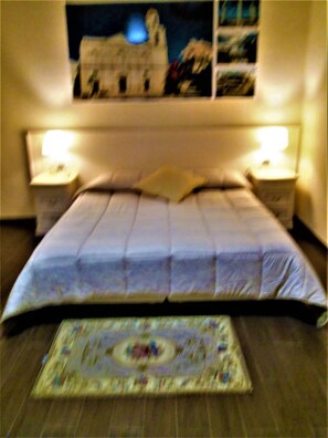 Deluxe Quadruple Room, 1 Bedroom, Private Bathroom, City View | 1 bedroom, Frette Italian sheets, premium bedding, down comforters