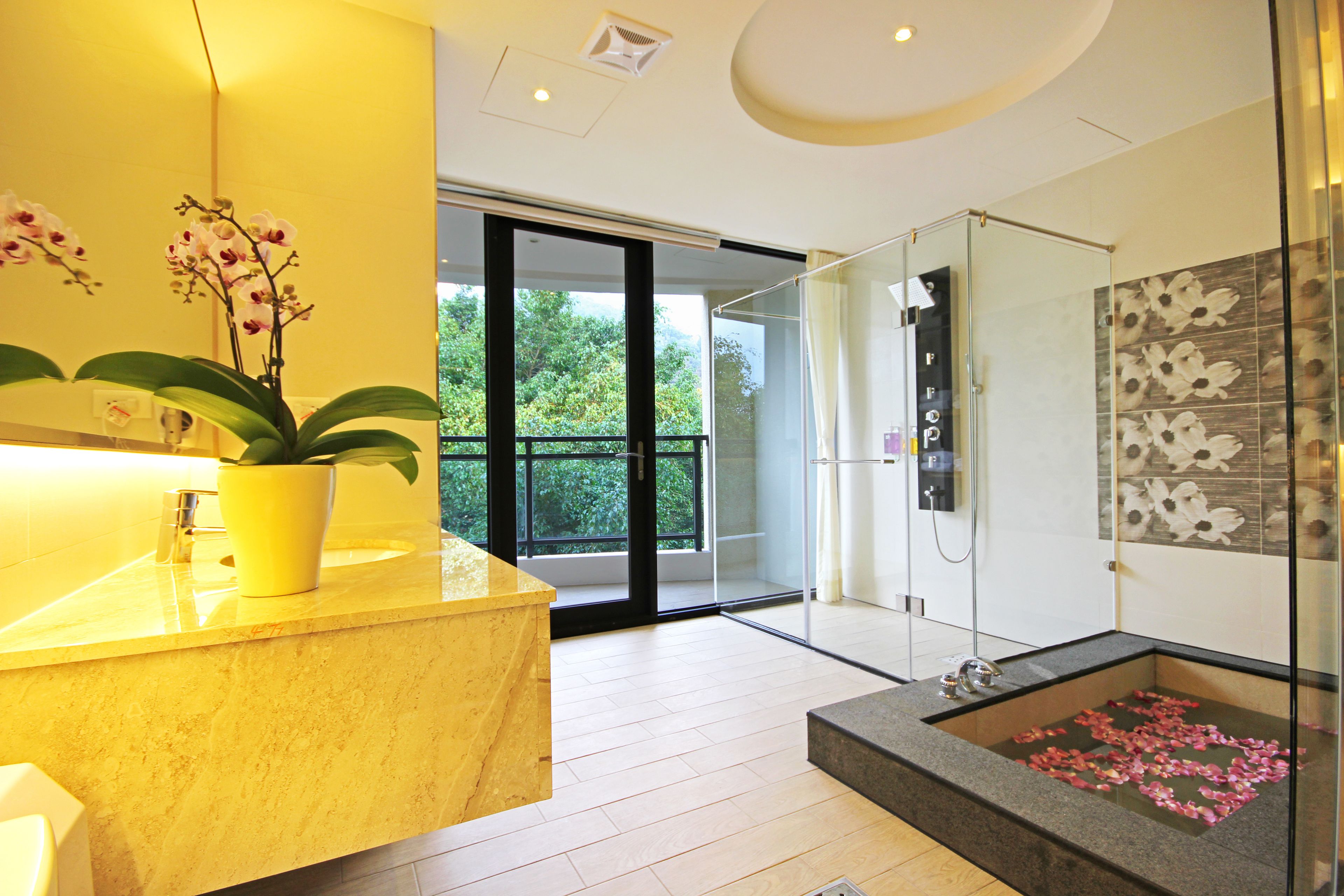 deluxe quadruple room, balcony | bathroom | shower, free toiletries, hair dryer, slippers