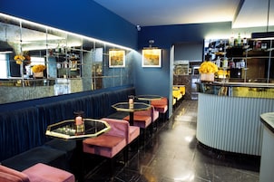 A bar area with seating and a counter.